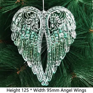 Detail of crystal angel wings hanging on pine branch with 125mm x 95mm dimensions
