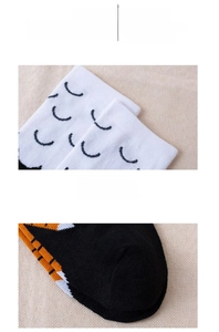 Detail view of knitted chicken claw socks showing high-quality cuff and animal print patterns
