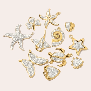 Golden stainless steel ocean theme charms with rhinestones including starfish and shell shapes