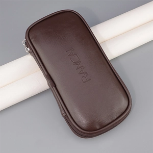 Detailed view of the dark brown PU leather makeup brush case with metallic zipper closure