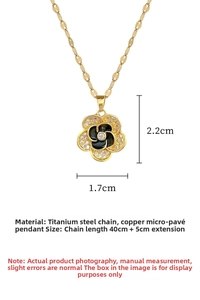 Macro detail of camellia flower pendant with micro-inlaid zircon and gold steel chain