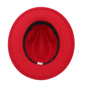 Interior view of red felt fedora showing size 54 label and black sweatband detail
