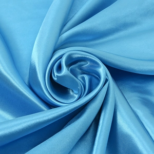 Glossy bright blue satin square scarf featuring a smooth silk-like texture and elegant drape