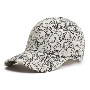 Fashion baseball cap featuring abstract face graffiti art in beige canvas material
