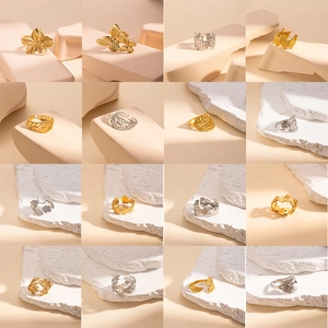 Collection of minimalist stainless steel open rings with floral and butterfly designs
