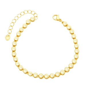 Elegant gold tennis bracelet with clear zircon stones and a heart charm extension