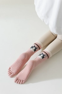 Pink five-toe yoga socks featuring a cute cat design and anti-slip silicone grip soles
