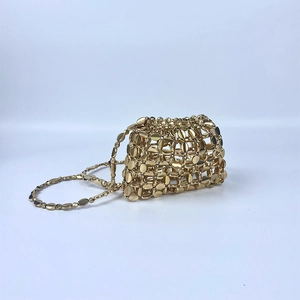 Detailed macro shot of the golden metallic sequin chainmail texture and link structure