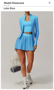 Three-piece Lake Blue yoga set with zip-up jacket, tank top and pleated skirt