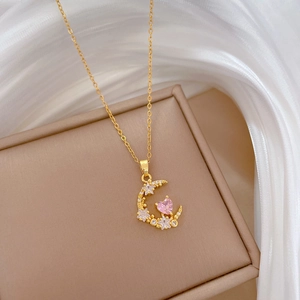 Elegant gold celestial necklace with diamond moon and pink heart stone pendant