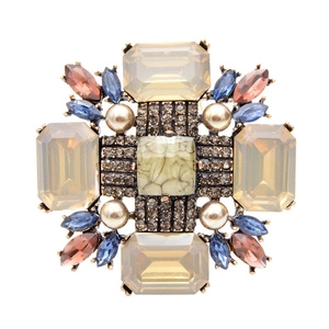 Vintage Baroque brooch with champagne gems, pearls, and green marble stone on white background