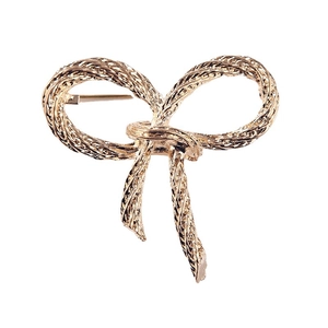 Elegant gold bow brooch with rope texture finish on a clean white background