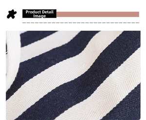 Macro shot of durable navy blue and off-white striped canvas fabric texture