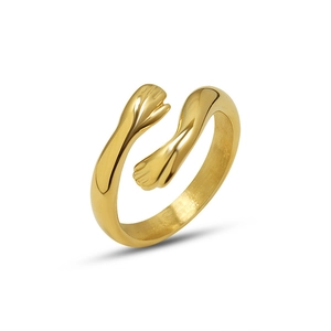 Minimalist gold hugging hands open ring in stainless steel with a polished finish