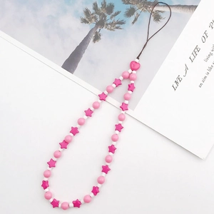 Close-up of handmade pink star beads phone charm with heart detail on a white background