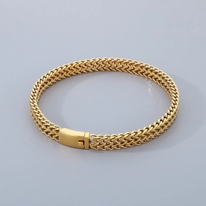 Macro detail of 18k gold plated stainless steel fish scale chain with rectangle clasp