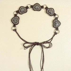 Brown leather heart-shaped rivet belt featuring vintage western western-style metal hardware