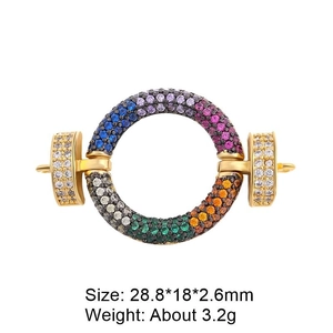 Macro detail of a gold-plated connector clasp with multi-colored cubic zirconia stones