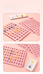 Detail of pink silicone DIY candy mold with dropper for heart and star shapes