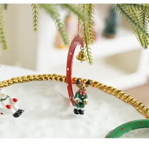 Detailed close-up of a festive Christmas ceramic tray featuring reindeer and snowmen