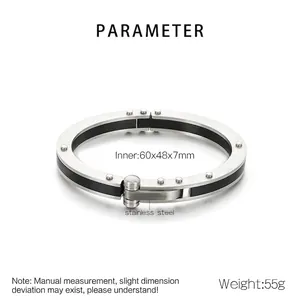 Detail of punk stainless steel unisex bracelet with black carbon fiber and rivet accents