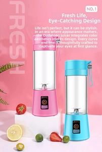 Close-up of portable pink and blue juicers with USB port and hanging strap details