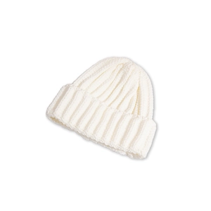 Close-up of white ribbed knit beanie hat showing soft wool blend texture and cuffed brim