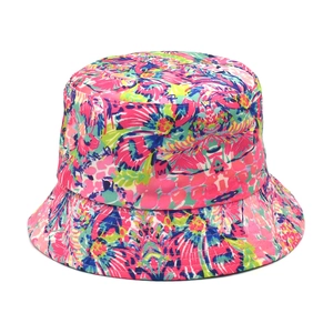 Close-up of a floral bucket hat featuring vibrant tropical prints and twill fabric texture