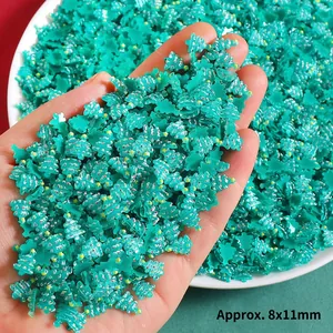 Close-up of mint green resin Christmas tree charms for DIY crafts, approx. 8x11mm size