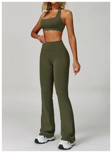 Detailed view of olive green high-waisted flared yoga pants and backless sports bra set