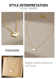 Detail showing gold heart pendant with white shell inlay and a small sparkling diamond