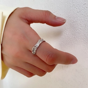 Minimalist S925 sterling silver ring with irregular liquid texture on thumb