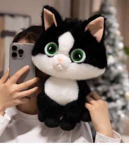 Close-up of cute plush cat toy with realistic fluffy fur and vivid green eyes details