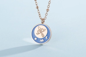 Detail of rose gold zodiac necklace with Sagittarius blue enamel coin pendant