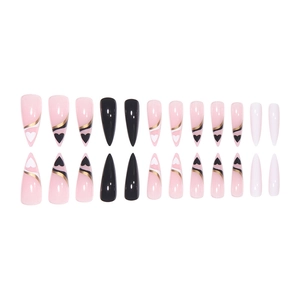 Long pointed press-on nails with pink, black, and white heart patterns and gold line art