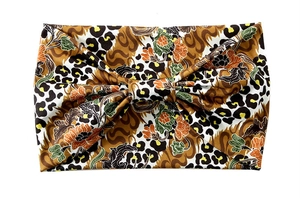 Detail of leopard print and floral batik elastic headband with central knot detail