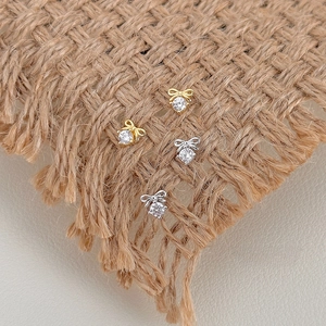 Elegant S925 silver bow stud earrings with sparkling cubic zirconia in gold and silver