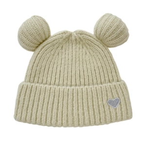 Detail of cream knit beanie featuring plush bear ears and a silver sequined heart patch