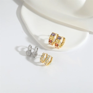 Chic set of gold and silver earrings with colorful zircons and round crystal studs