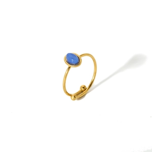 Close-up of adjustable 18K gold-plated ring with oval blue natural stone and sphere tips