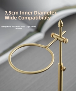 Detail of adjustable brass coffee dripper stand with 7.5cm inner ring on wooden base