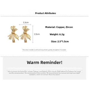 Detailed view of gold plated bow earrings with zircon inlay showing 2.5cm height dimension