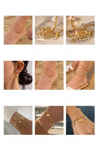 Detail view of gold titanium steel beach jewelry collection with shell and starfish charms