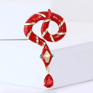 Exquisite snake brooch with red enamel gold stripes and a sparkling teardrop gemstone