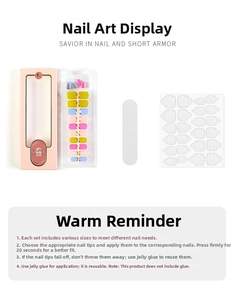 Detail view of colorful press-on nail kit with pink box, nail file, and adhesive stickers