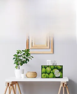 Detail of DIY diamond painting tissue box featuring a green apple design on a wooden stand