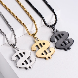 Detailed view of dollar sign pendants in gold, silver and black on a white display stand