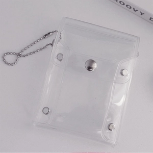 Close-up of clear PVC glitter card holder with silver metal snaps and bead chain
