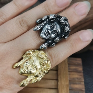 Punk style Medusa head embossed rings in gold and silver finish on hand