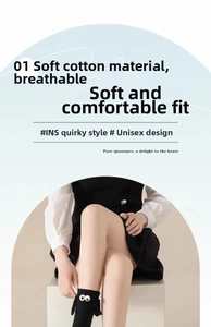Detail of soft cotton magnetic hand-holding black crew socks with 3D eyes character